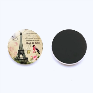 Detail of round Paris Eiffel Tower magnets with vintage floral design and magnetic back