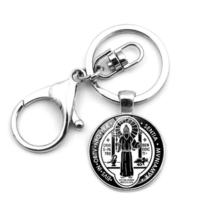 Religious Saint Benedict Medal keychain with silver lobster clasp on white background
