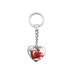 Polished silver heart keychain with a vintage key and red heart pattern on white background