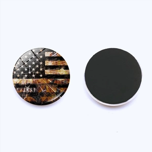 Detail view of American flag fridge magnet with crystal glass dome and magnetic backing