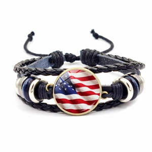 Detail of multi-layer leather bracelet with US flag glass cabochon and metal beads