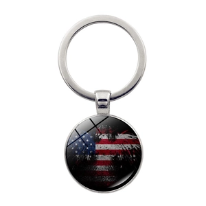 Macro shot of silver metal keychain with glass American flag and eagle pendant detail