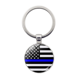 Silver Thin Blue Line American Flag key ring with glass dome pendant on white background