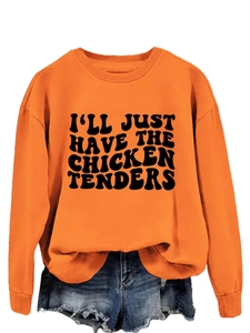 Close-up of the black slogan print on the orange crewneck sweatshirt with soft cotton texture