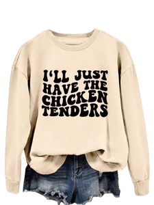 Detail view of a beige long sleeve sweatshirt with I'll Just Have The Chicken Tenders slogan