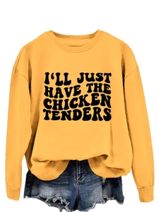 Detail of vintage slogan print on yellow long sleeve sweatshirt and frayed denim shorts