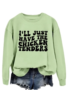 Detail of mint green sweatshirt featuring bold black I'll Just Have The Chicken Tenders print