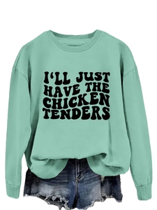 Close-up of the mint green crewneck sweatshirt with I'll Just Have The Chicken Tenders text