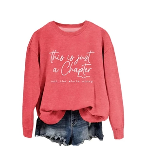 Women's coral red crewneck sweatshirt with 'this is just a chapter' slogan print