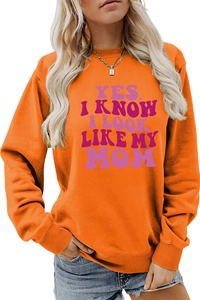 Detail of orange sweatshirt with Yes I Know I Look Like My Mom text print and ribbed cuffs