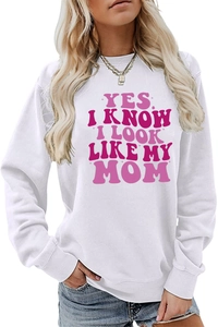 Close-up of pink retro lettering on a white crewneck sweatshirt for women