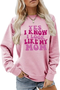 Close-up of pink long sleeve sweatshirt with Yes I Know I Look Like My Mom slogan print