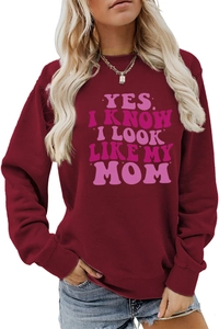 Detail of burgundy sweatshirt with pink 'YES I KNOW I LOOK LIKE MY MOM' slogan print