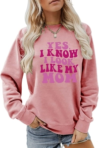 Close-up of ribbed cuffs and pink retro typography print on casual long sleeve sweatshirt