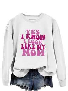 Close-up of pink and purple letter print on white crew neck long sleeve sweatshirt