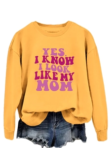 Detail of ginger long sleeve sweatshirt with bold YES I KNOW I LOOK LIKE MY MOM print