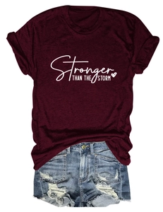 Detail of burgundy T-shirt with Stronger than the Storm print and soft heather texture