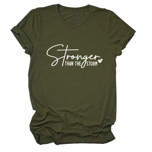 Close-up of military green t-shirt featuring white Stronger than the Storm slogan print