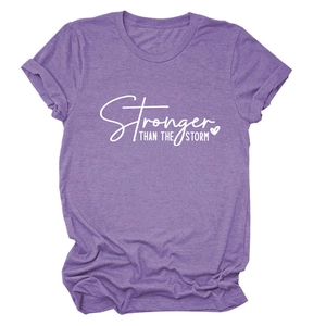 Detail of purple cotton blend T-shirt with Stronger Than The Storm slogan and heart print