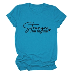 Flat lay of a teal cotton blend T-shirt featuring Stronger Than The Storm slogan print