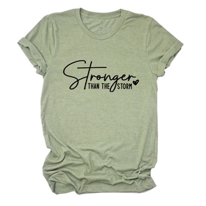 Detail of rolled sleeve and printed slogan on green cotton crew neck T-shirt