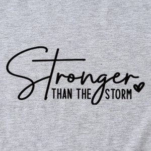 Gray cotton t-shirt featuring black Stronger Than The Storm text and heart graphic
