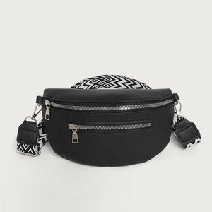 Minimalist black crescent crossbody bag with geometric wide strap and double zippers
