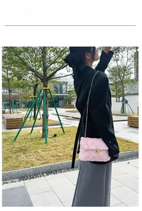 Close-up of pink quilted faux fur crossbody bag with golden chain and twist lock