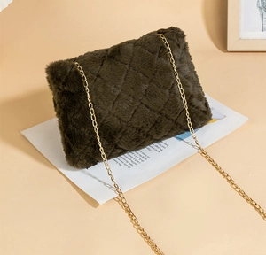 Detailed view of dark olive faux fur crossbody bag featuring gold chain and diamond pattern