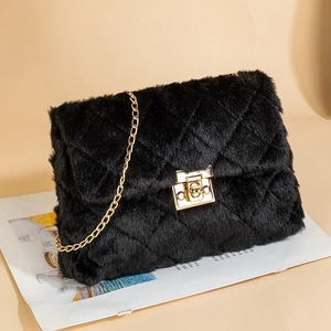 Quilted black faux fur shoulder bag with gold chain strap and twist lock closure