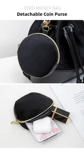 Close-up of detachable black velvet round coin purse with gold zipper for small items