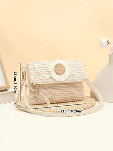 Detail view showing dimensions of straw crossbody bag with daisy floral lock detail