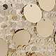 Detailed close-up of champagne gold sequins on a stylish women shoulder handbag