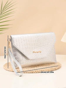 Detail showing dimensions of silver crocodile pattern envelope clutch bag with wristlet