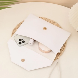 Minimalist white faux leather envelope clutch with gold magnetic clasp and wrist strap