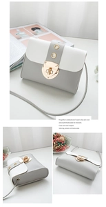 Détail du mini sac bandoulière avec fermoir doré tournant et contraste de couleurs gris-blanc