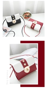 Détail du sac bandoulière bicolore avec boucle à œillets métalliques et lanière