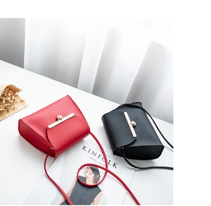 Minimalist red and black leather crossbody bags with gold metal locks and thin straps