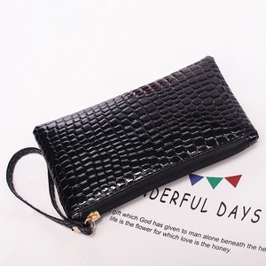 Glossy black crocodile-embossed leather wristlet clutch bag with gold zipper for women