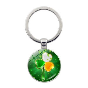 Detail showing the Irish flag shamrock glass cabochon pendant on a silver keychain