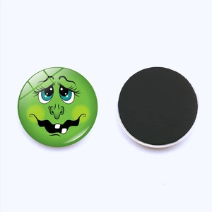 Front and back detail of green cartoon snowman magnet with glossy glass surface
