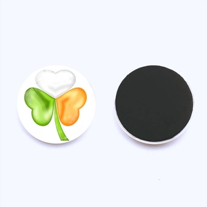 Detail of round Irish clover fridge magnet with magnetic back for home decoration