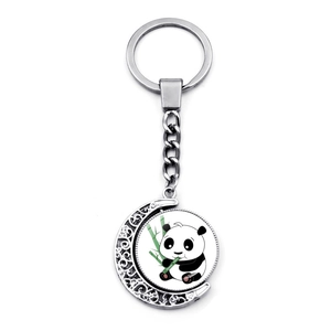 Porte-clés lune rotatif avec motif panda mignon mangeant du bambou en métal argenté