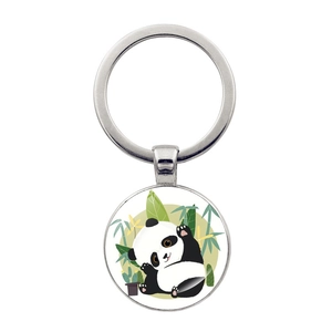 Detail of silver metal keychain featuring a cute panda illustration with bamboo leaves
