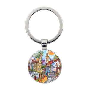 Artistic round keychain featuring a colorful city architecture illustration in silver frame