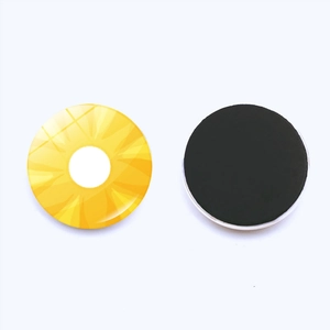 Macro detail of round pineapple fridge magnet with glossy finish and black magnetic backing