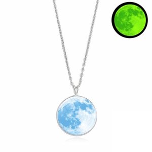 Luminous moon pendant necklace showing light blue texture and green glow in the dark