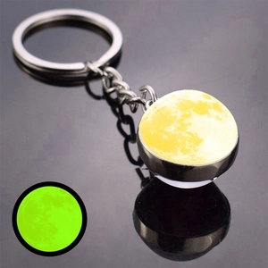 Glow in the dark moon keychain with double-sided luminous lunar surface and silver ring
