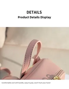 Detail showing the comfortable soft PU leather handle of the pink bow backpack