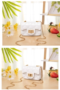 Detail of white quilted jelly bag with gold turn-lock closure and metal chain strap